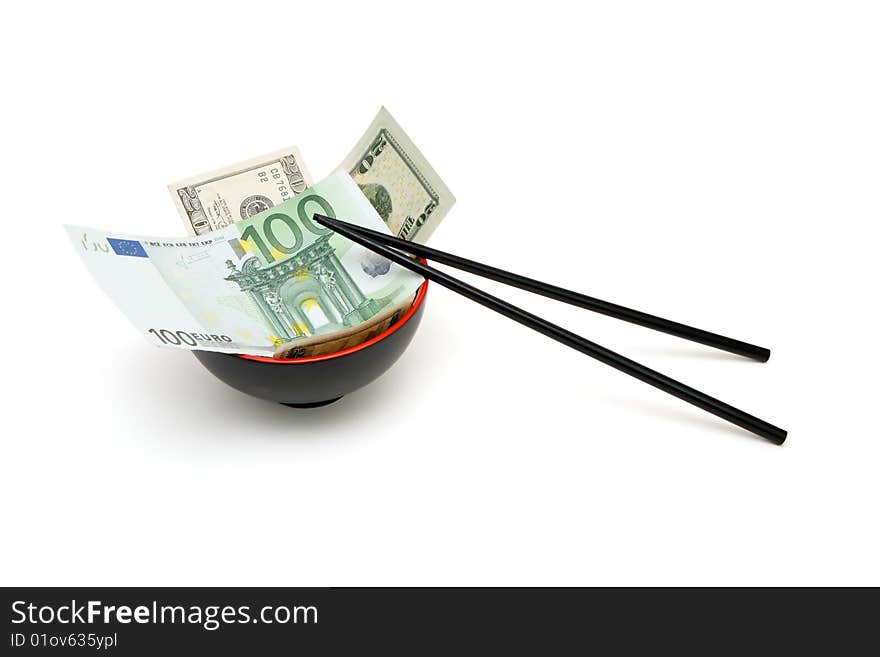 Money in red and black oriental bowl with chopsticks isolated. Money in red and black oriental bowl with chopsticks isolated