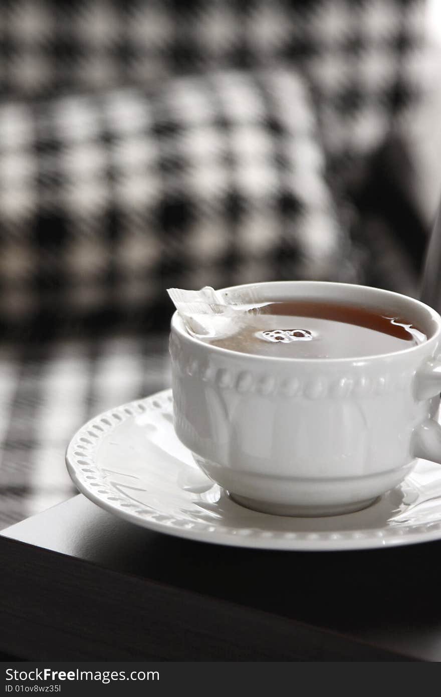 Cup of tea in the morning; ceramic white cup and saucer