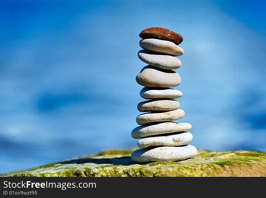 Different cobblestones put as a stack on the cliff. Different cobblestones put as a stack on the cliff