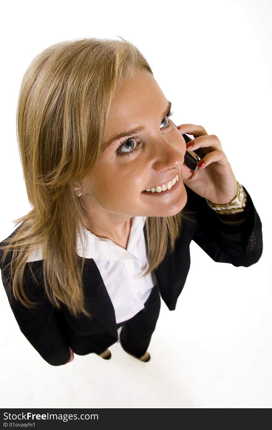 Wide angle picture of an attractive businesswoman on the phone