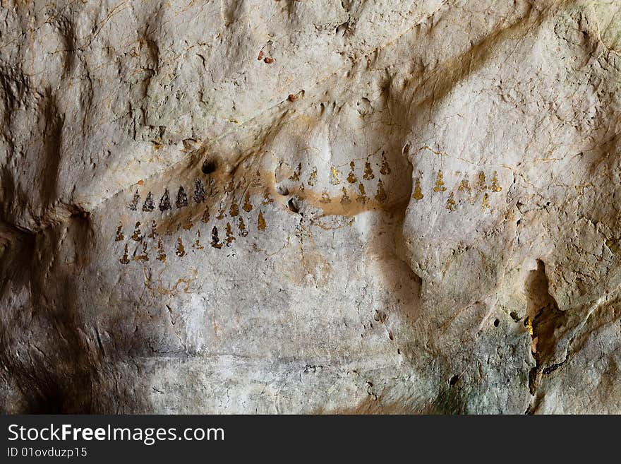 Budhist Symbols On A Cave Wall