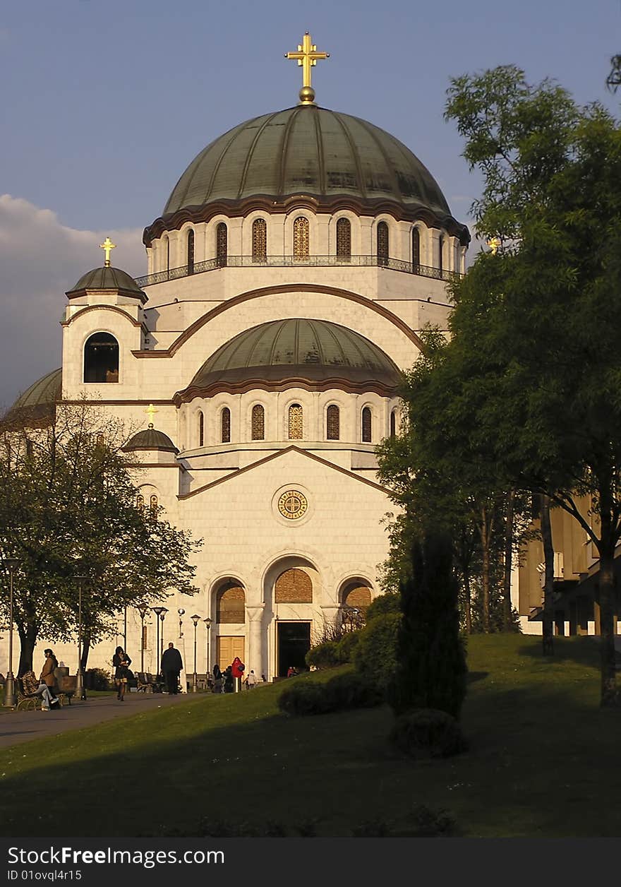 Main entrance to orthodox church in Belgrade Serbia, temple of Sveti Sava, against clear blue sky.