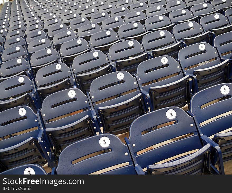 Empty rows of seats in a baseball stadium. Empty rows of seats in a baseball stadium.