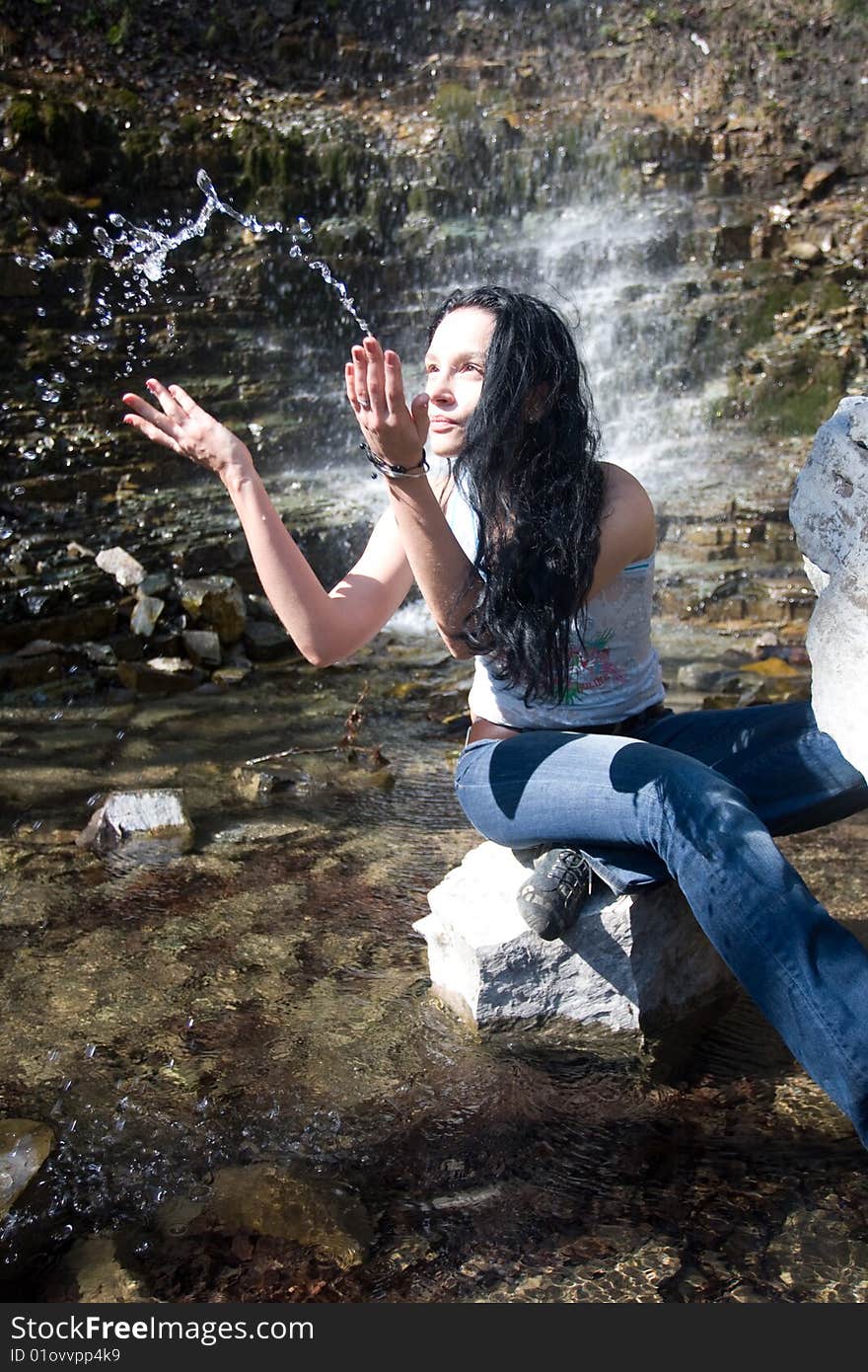 Woman near waterfall