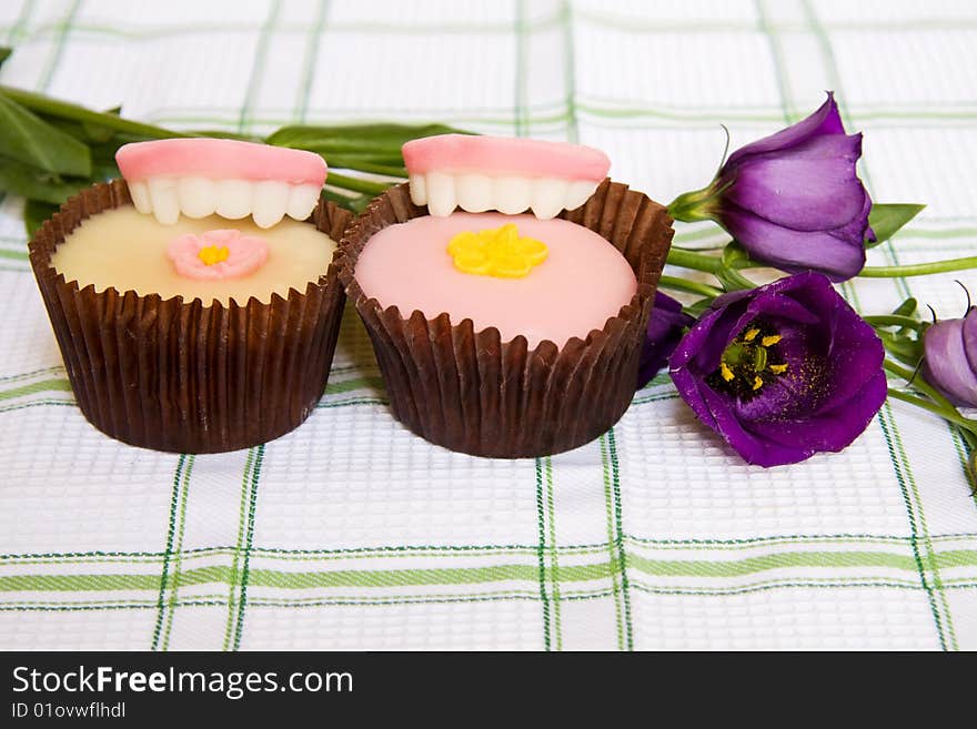 Gluttony concept with cupcakes and candy dentures