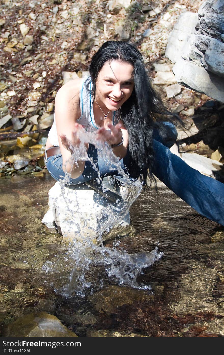 Woman near waterfall