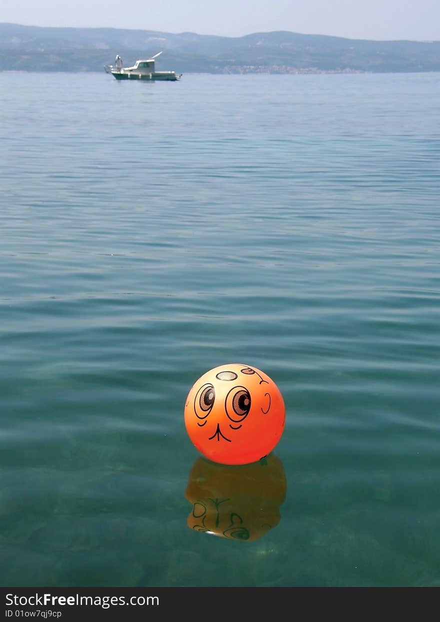 Ball Funny And Boat On Sea