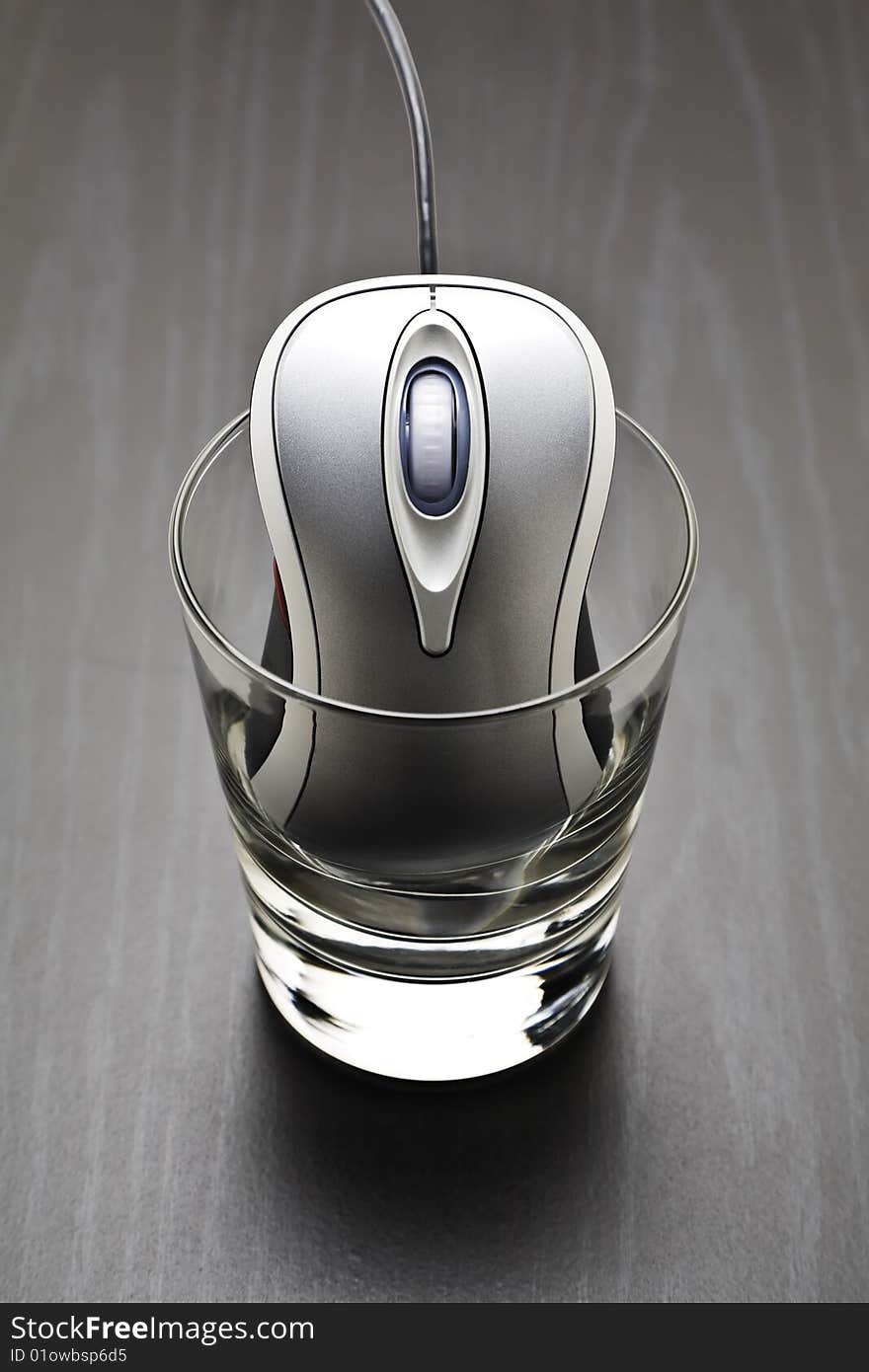 Computer mouse in a glass