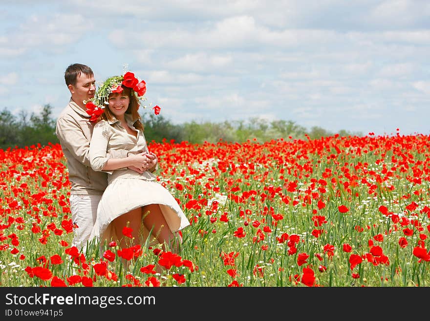 Couple On Red Poppies Field