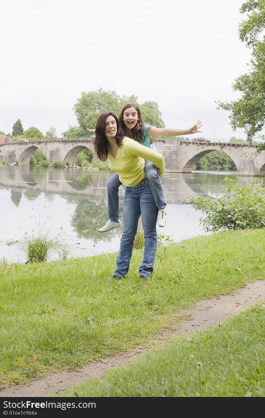 Mother and daughter playing in the park