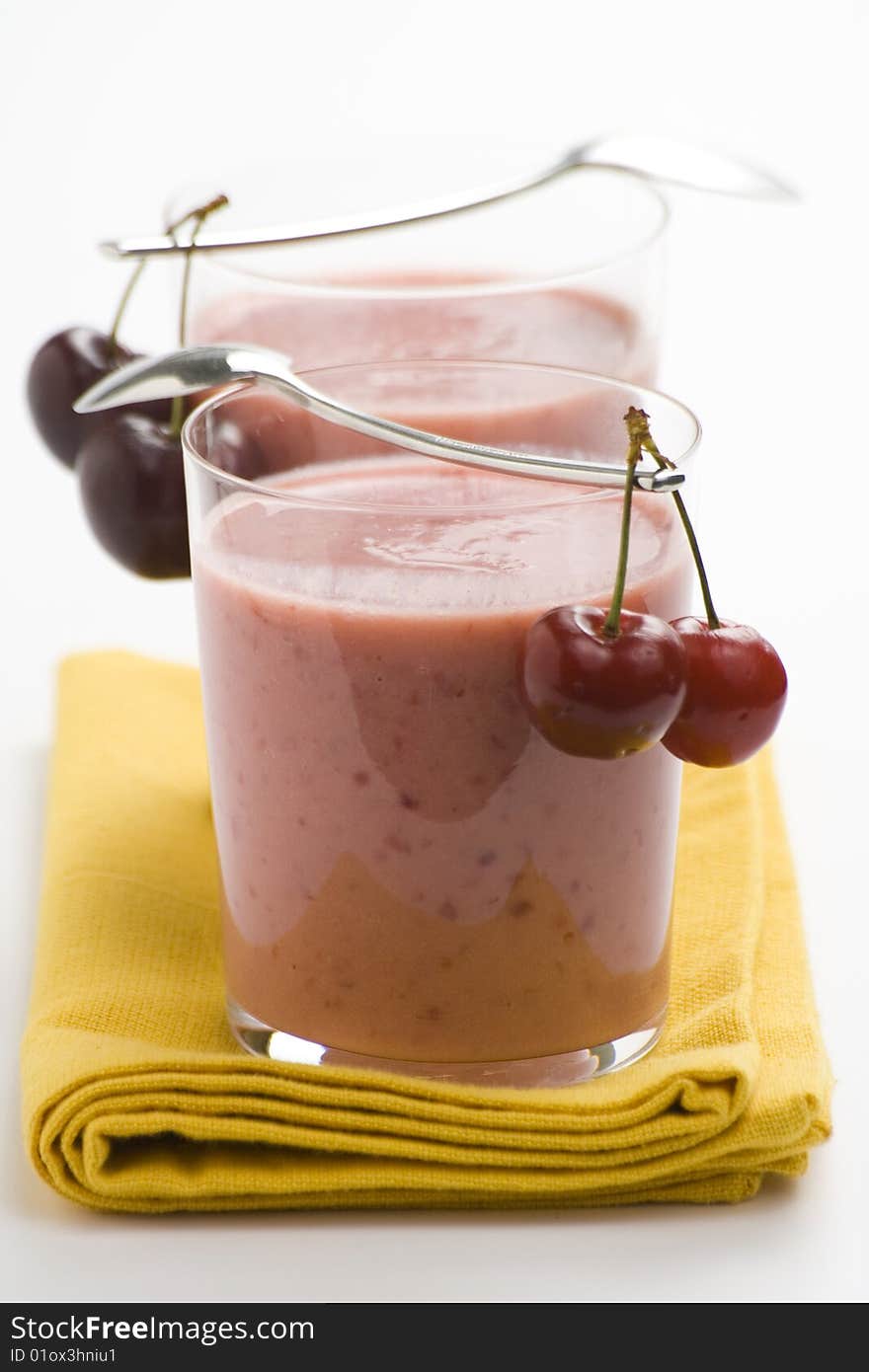 A delicious cherry milkshake isolated over white