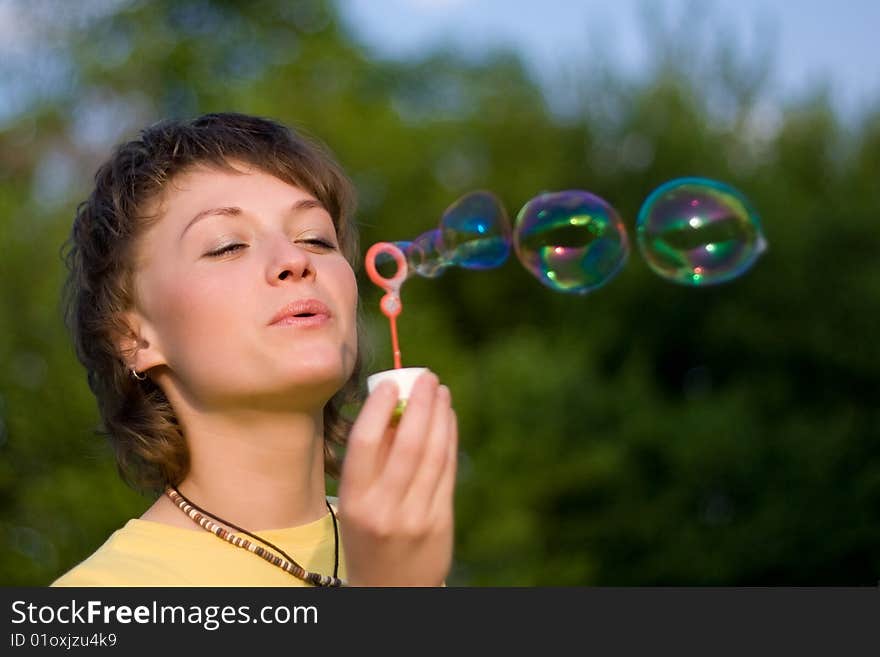 Young Woman And Soap-bubbles