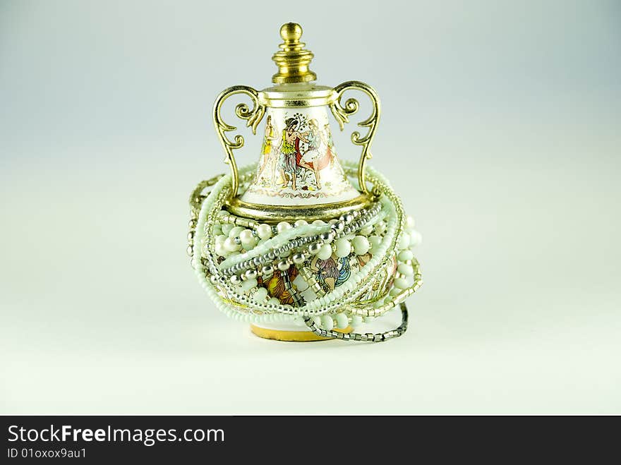 Old amphora with perfumes and accessories