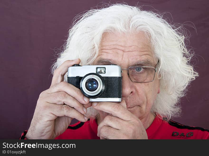 Older man taking a photo