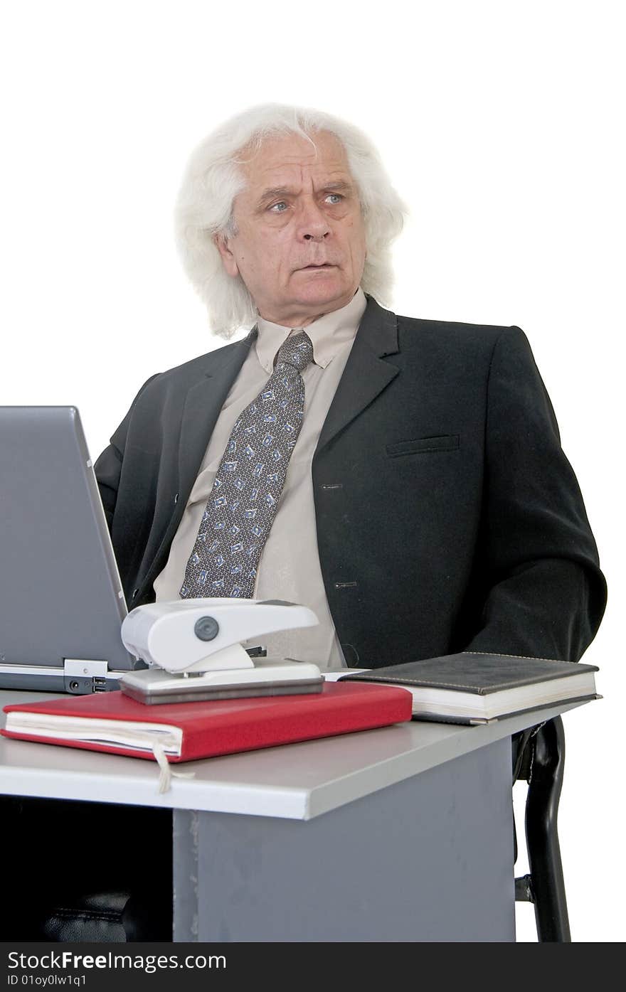 Older man in office making plans