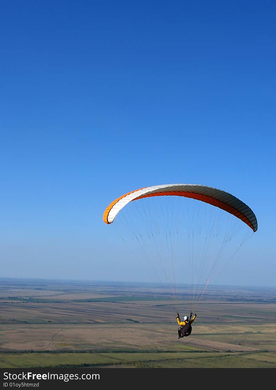 Paraglider flying in the sky