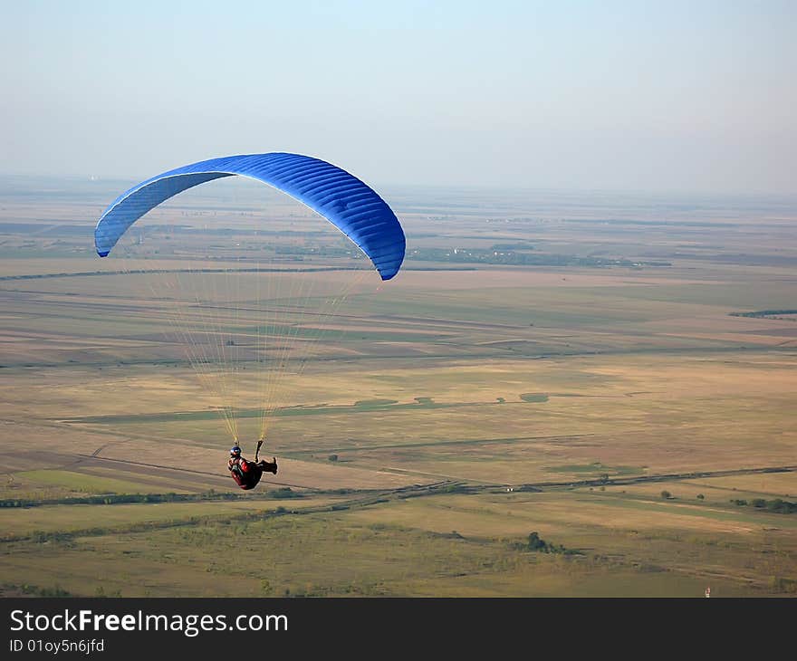 Paraglider flying in the sky