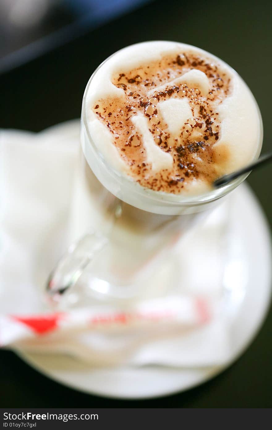 Cappuccino with a heart shape of cocoa. Cappuccino with a heart shape of cocoa