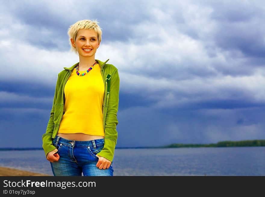 Beautiful girl on the autumn beach