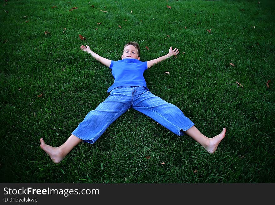 Boy on a green grass