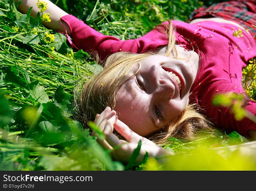 Happy girl in green grass. Happy girl in green grass