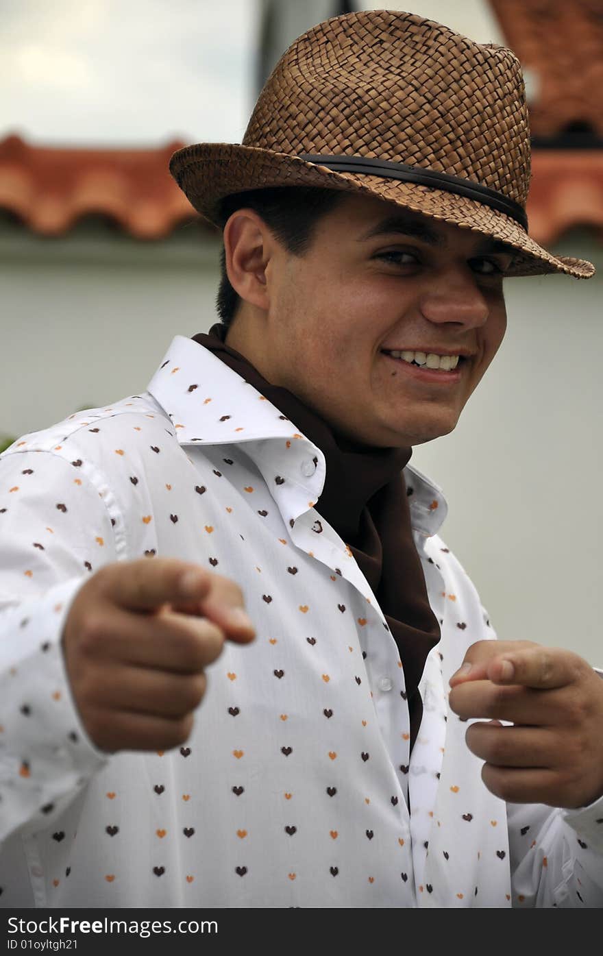 Young man with a hat and a shirt pointing. Young man with a hat and a shirt pointing.