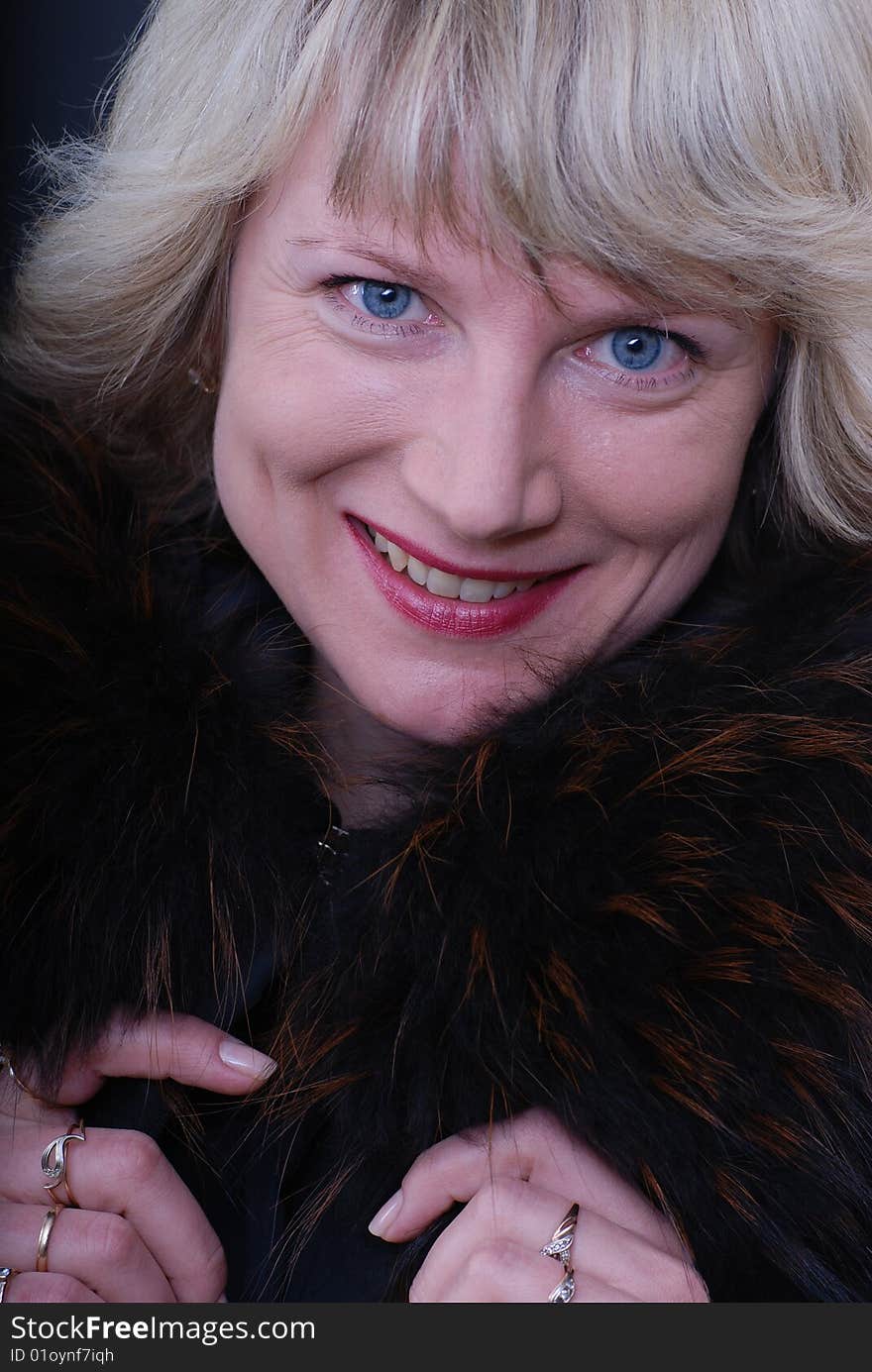 Smiling Woman  In Fur Coat