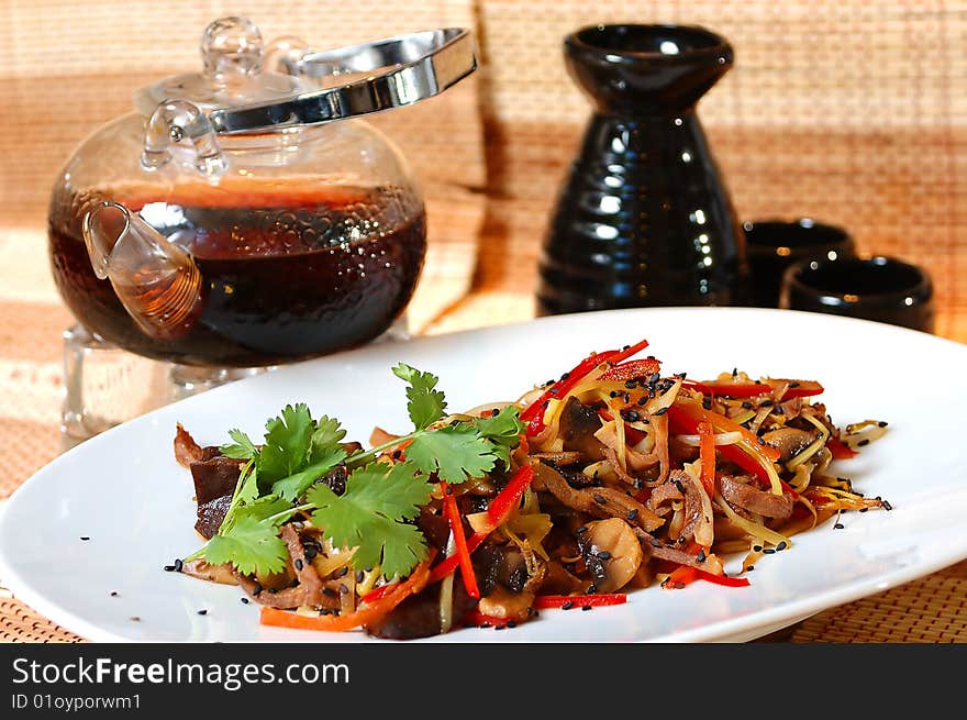 Salad with chinese tea on a table at restaurant