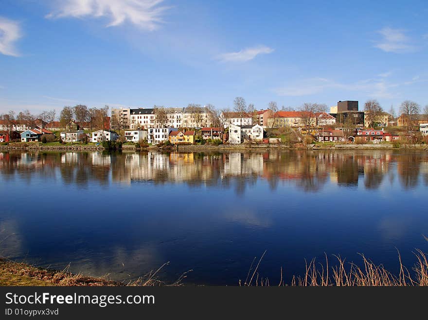 Houses reflected on the river. Houses reflected on the river