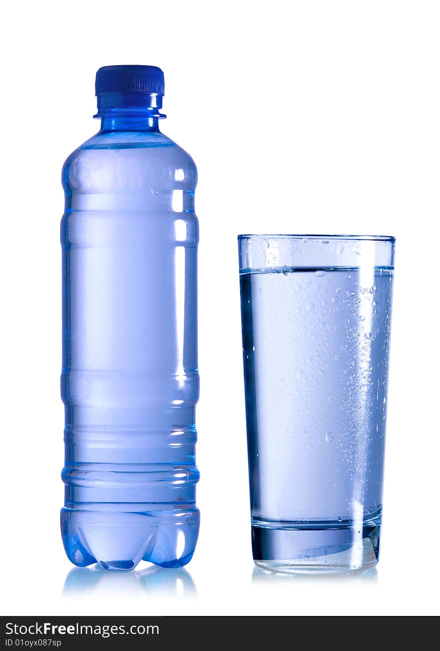 A bottle of water with glass on white background. A bottle of water with glass on white background