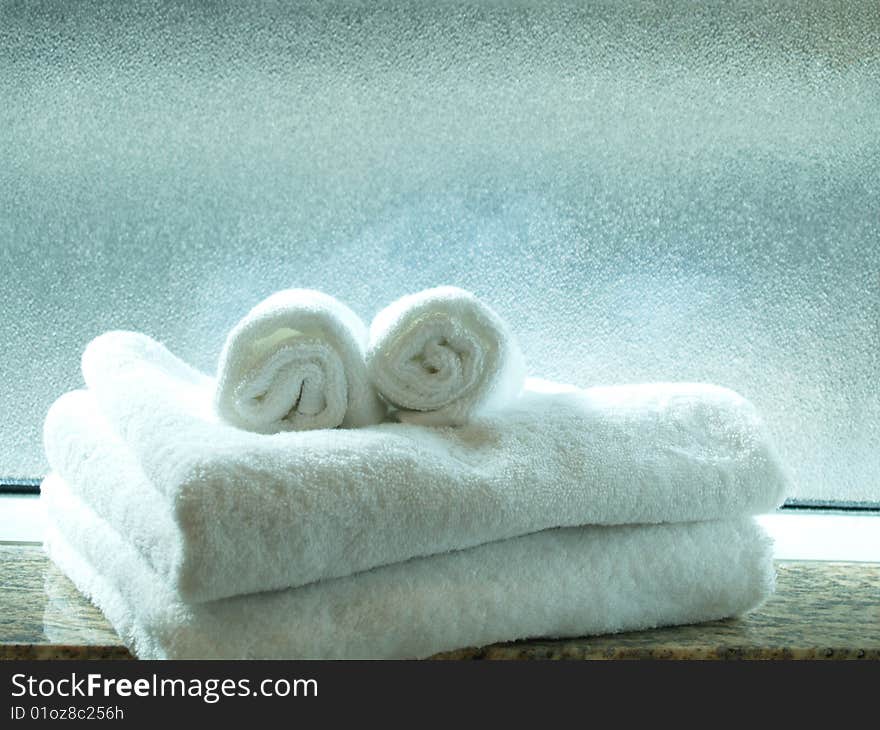 Face-like towels in front of a translucent window. Face-like towels in front of a translucent window