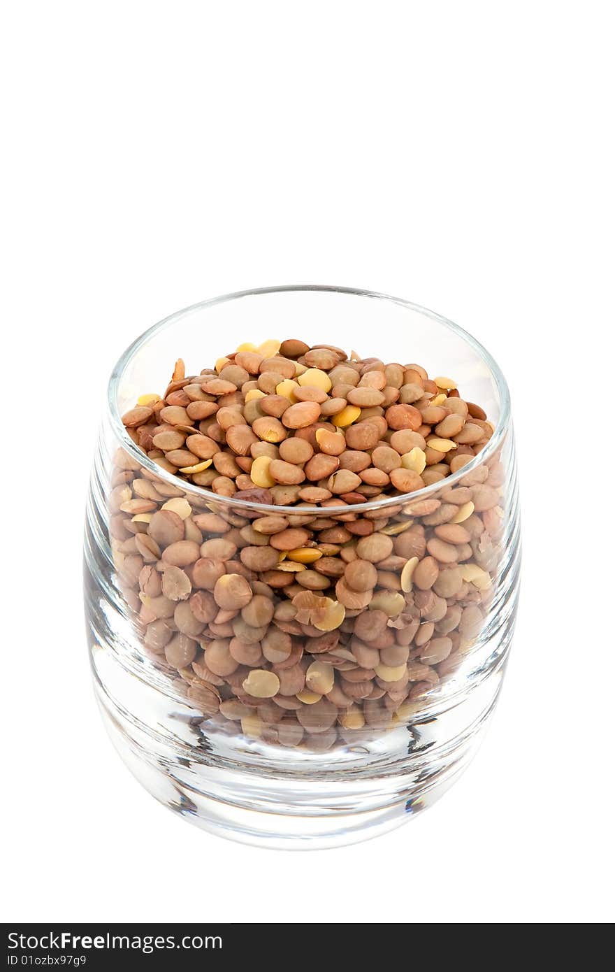 Lentils in glass, white background