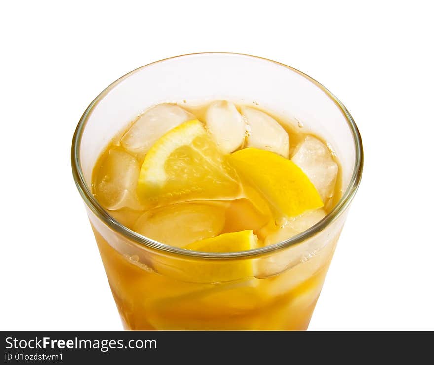 Glass ice-tea with the pieces of lemon