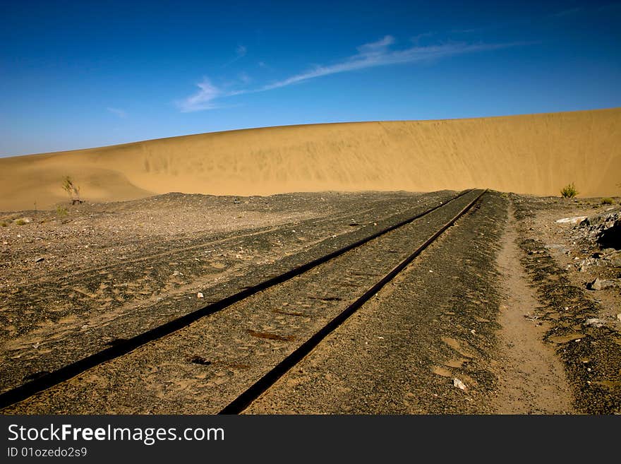 Sand dune that has engulfed a railway line in Namibia. Sand dune that has engulfed a railway line in Namibia