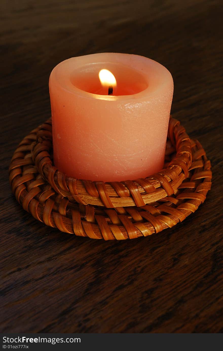 Candle on wood