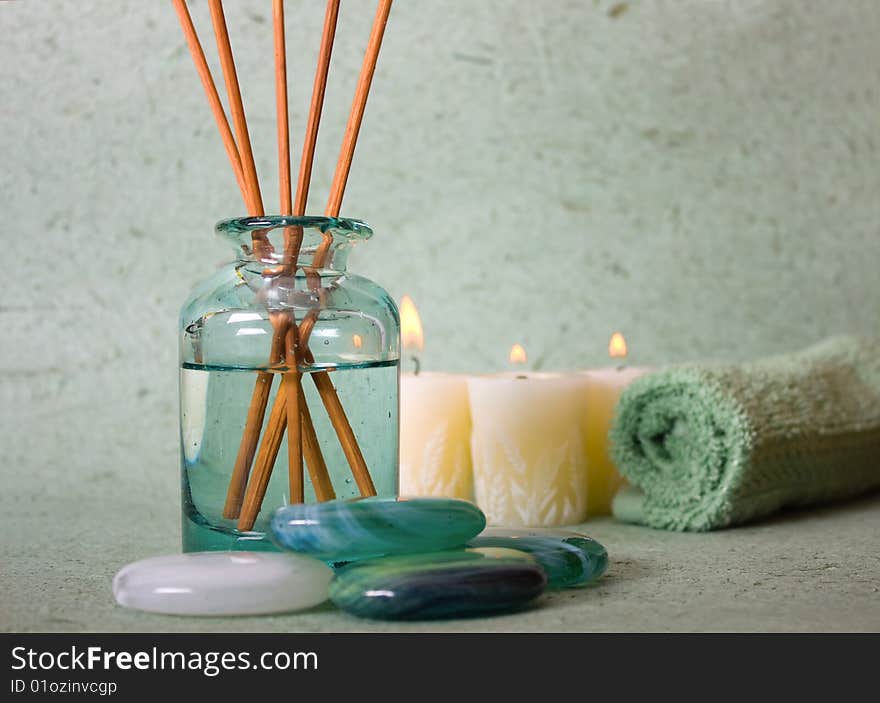 Zen stones with spa with candles on a bluw background. Zen stones with spa with candles on a bluw background.