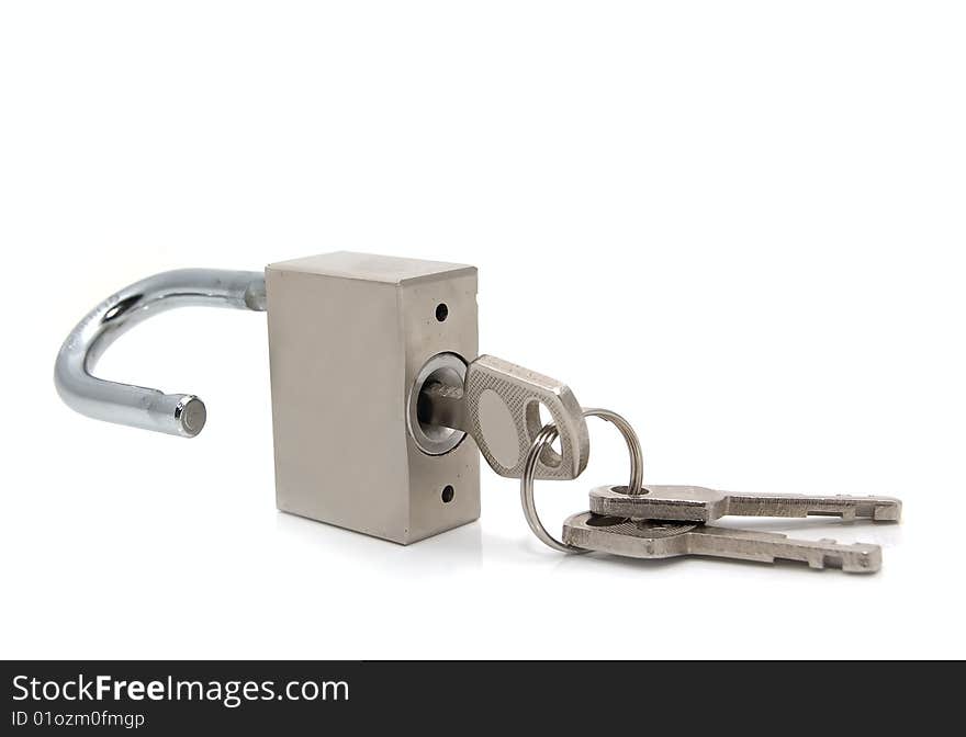 Opened steel padlock with keys on a white background. Close-up. Macro.