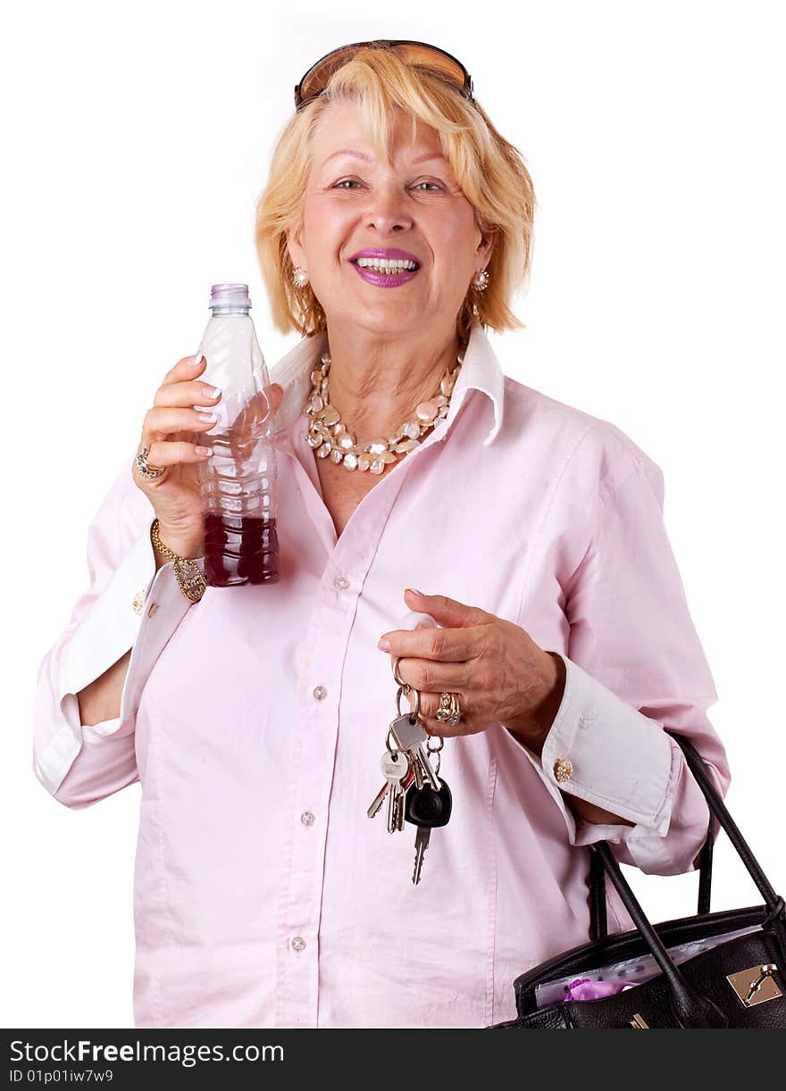 Senior Woman with bottle of juice (isolated on white). Senior Woman with bottle of juice (isolated on white)