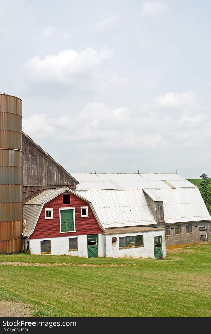 An old country dairy farm with milk room, silo and barn, abandoned. An old country dairy farm with milk room, silo and barn, abandoned.