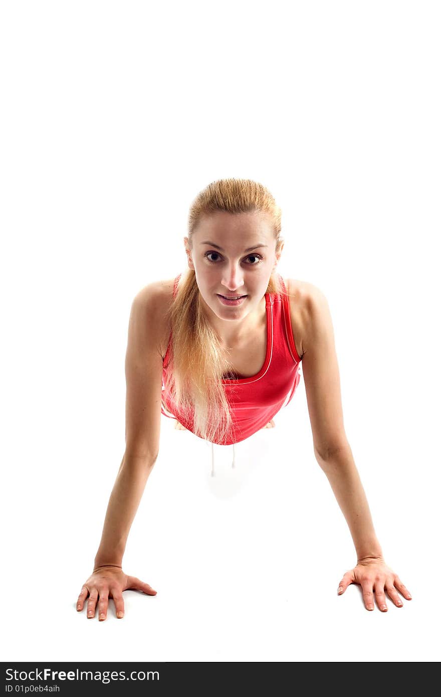 Blond girl doing gymnastic exercises