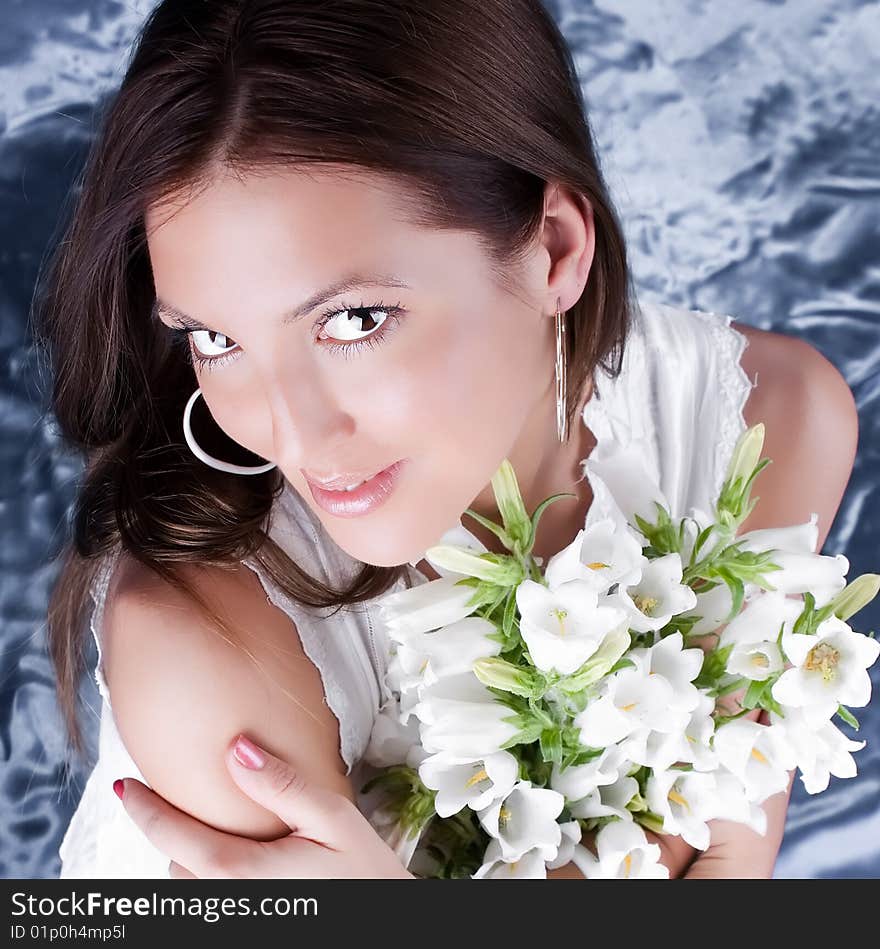 Beautiful brunette hold a bouquet