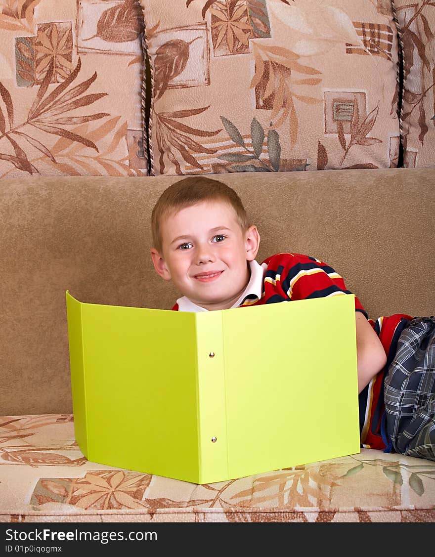 Portrait of  boy laying on a sofa of the house. Portrait of  boy laying on a sofa of the house