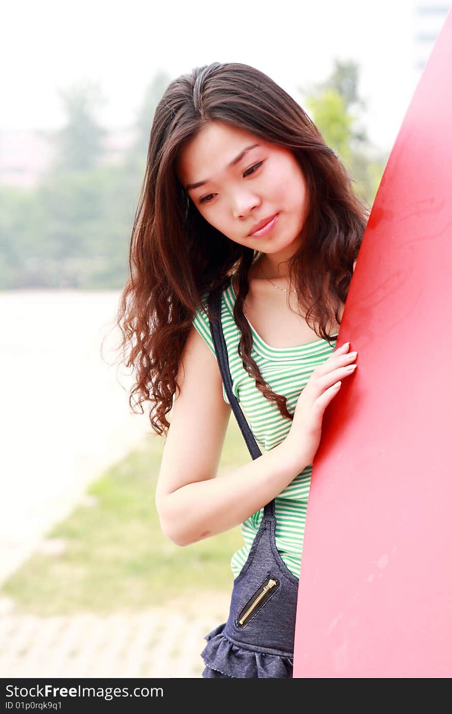 A modern asian girl outdoors. A modern asian girl outdoors