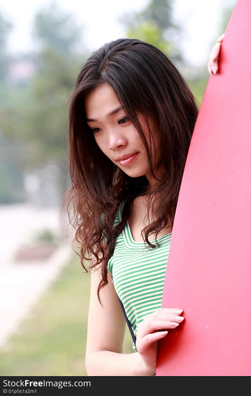 A modern asian girl outdoors. A modern asian girl outdoors.