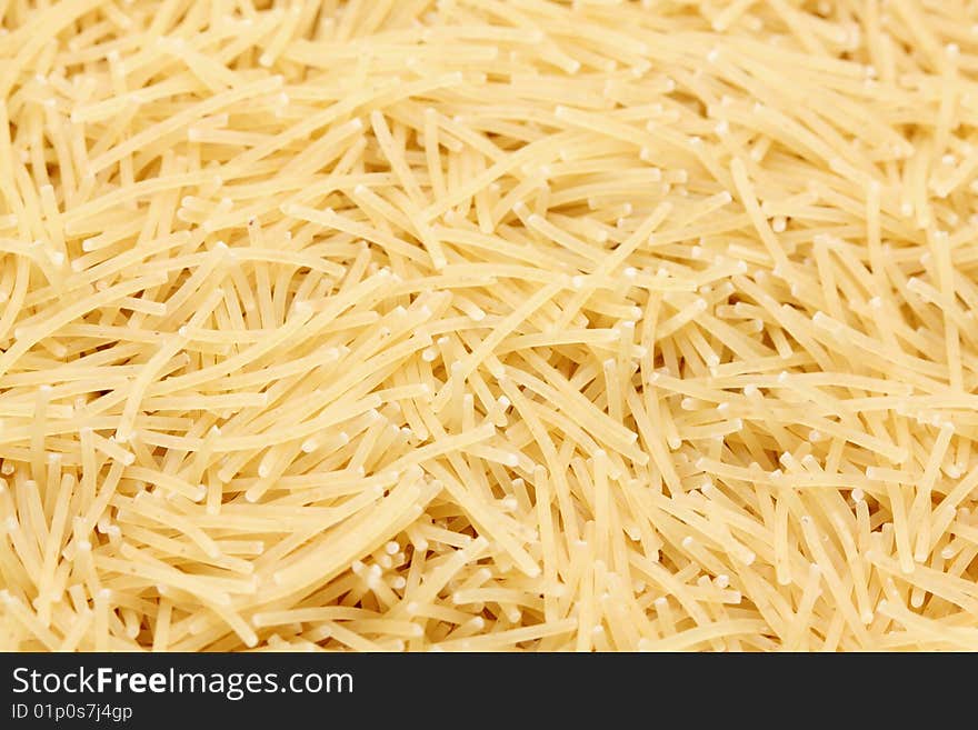 A macro shot of a heap of vermicelli pasta. A macro shot of a heap of vermicelli pasta.