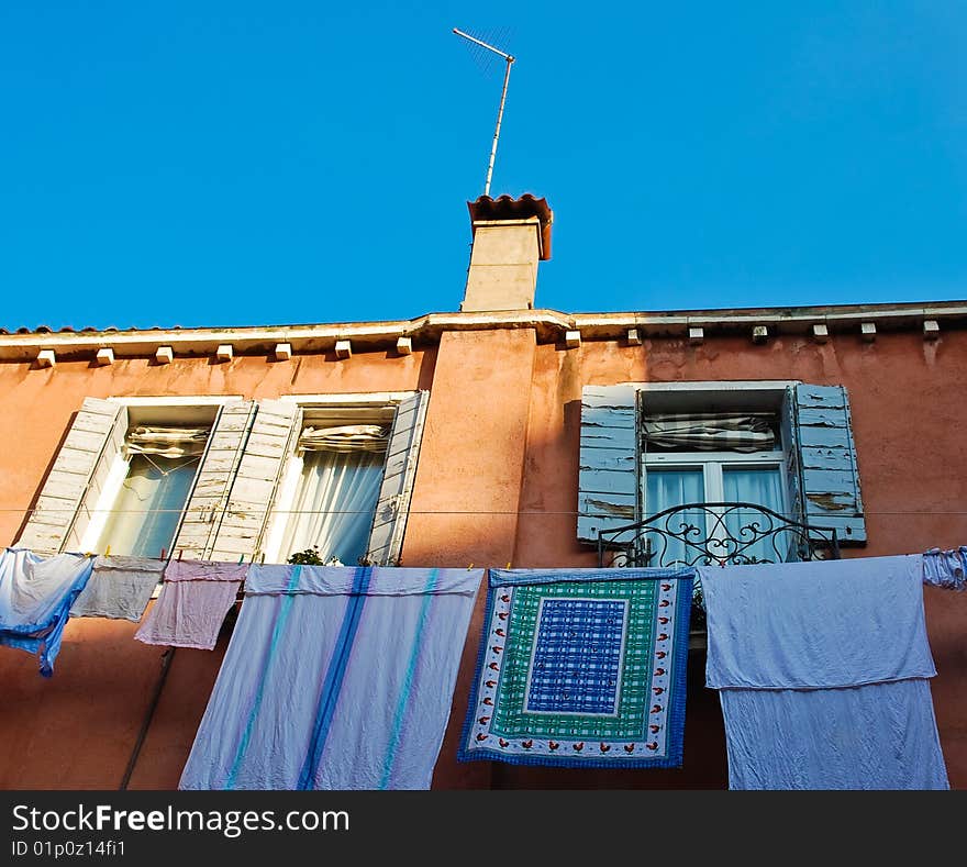 Wall of an old Venice building with drying laundry. Wall of an old Venice building with drying laundry