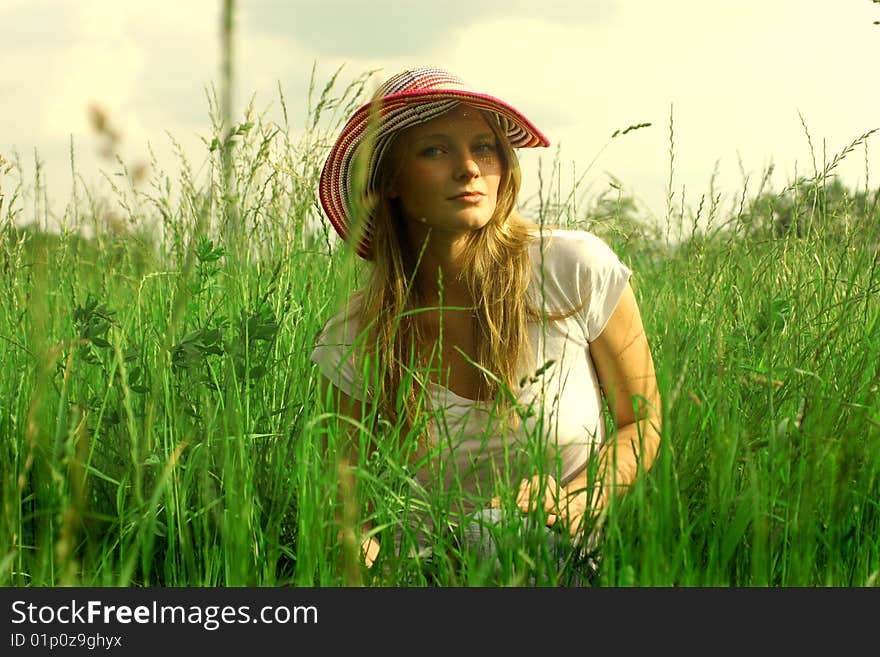 Young woman in grass field