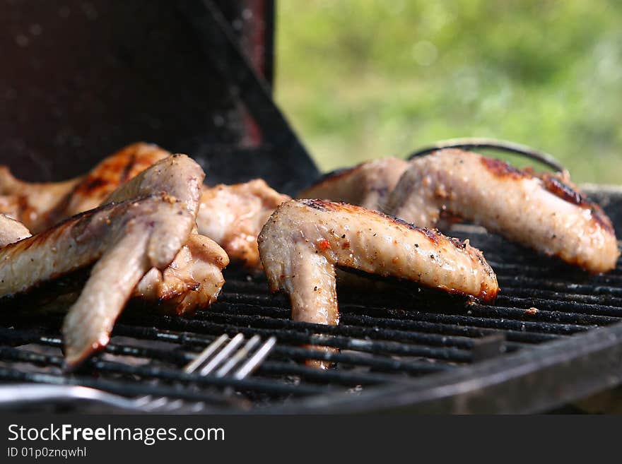 A chicken legs on the grill