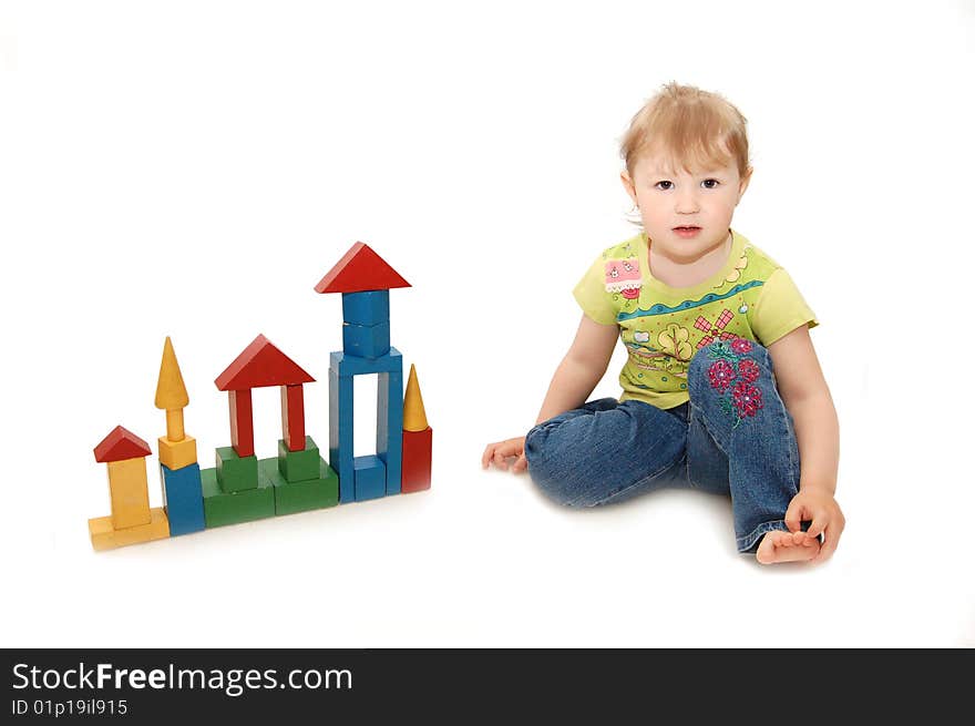 Little girl playing with cubes