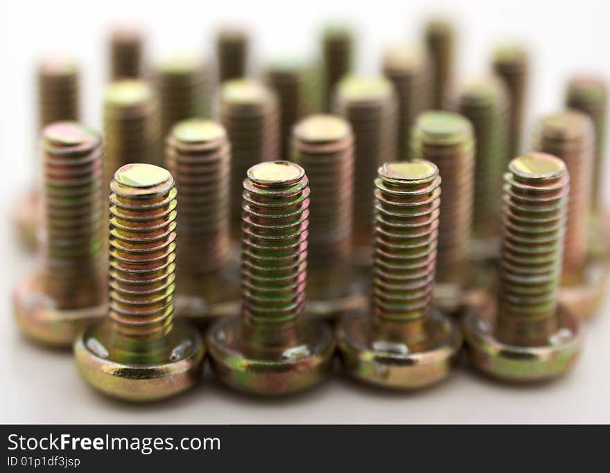 Metal bolts in row isolated on white background